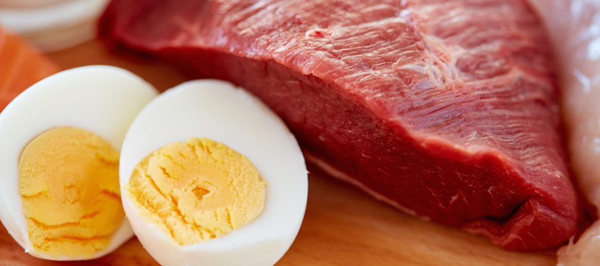 healthy lifestyle, culinary, cooking and diet concept - close up of red meat fillets and boiled eggs